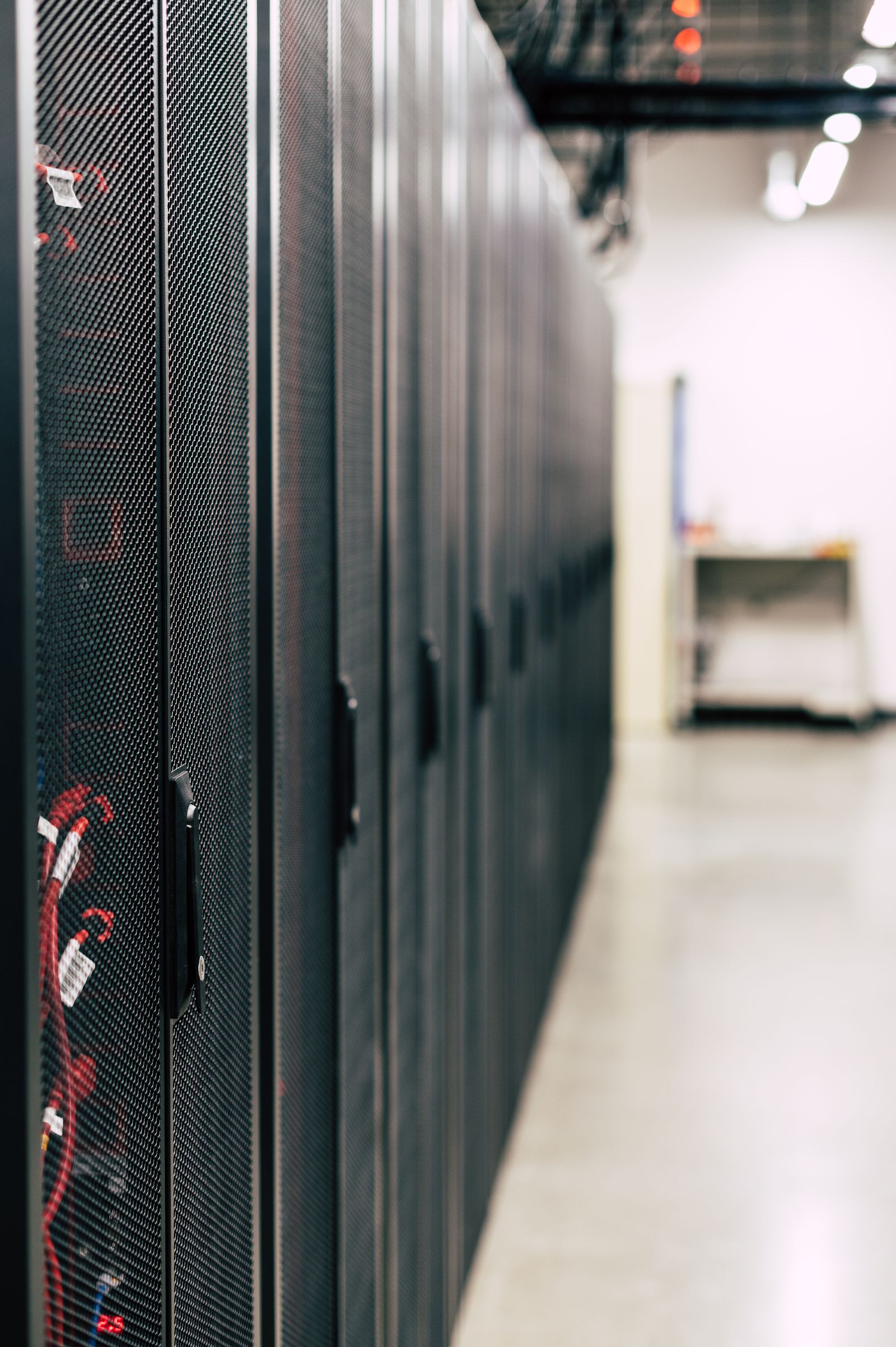 Rows of illuminated server racks in a data centre